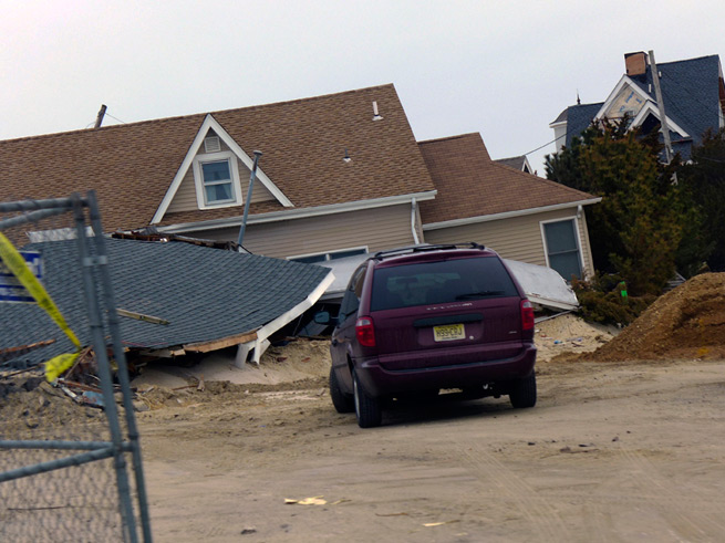 Fallen house with van