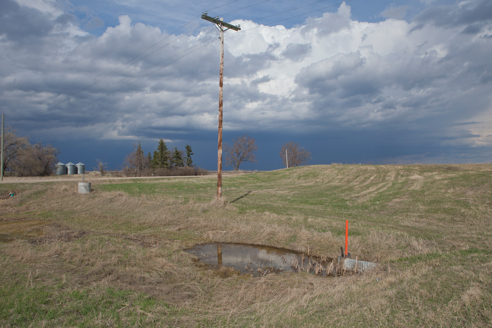 Telephone pole and approaching storm